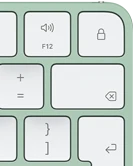 Magic Keyboard, top-right corner, green color, Touch ID , delete key, and volume function keys