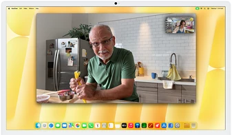 Desk View demonstration. Person on a video call watching top-down view of a baker decorating a cookie