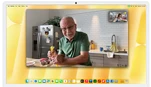 Desk View demonstration. Person on a video call watching top-down view of a baker decorating a cookie