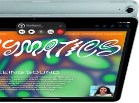 iPad Air, with 12MP Center Stage camera showing a user on FaceTime, in front of another iPad Air model showing the back exterior and camera