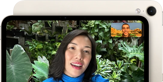 iPad mini, front view, displaying a Landscape 12MP Center Stage front camera interface, showing a person video calling amidst green foliage