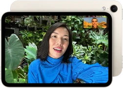 iPad mini, front view, displaying a Landscape 12MP Center Stage front camera interface, showing a person video calling amidst green foliage