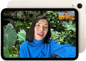 iPad mini, front view, displaying a Landscape 12MP Center Stage front camera interface, showing a person video calling amidst green foliage