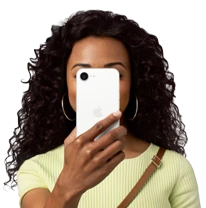 Person holding iPhone 16e in front of their face