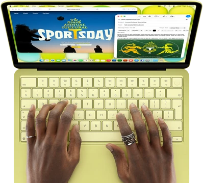 MacBook Neo, citrus color, hands on keyboard, user is composing an email invitation to the opening of an art exhibit, website for the event open alongside