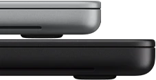 14-inch MacBook Pro with PROLED XDR Display, silver color, stacked on top of 16-inch model, space black color, showing size difference